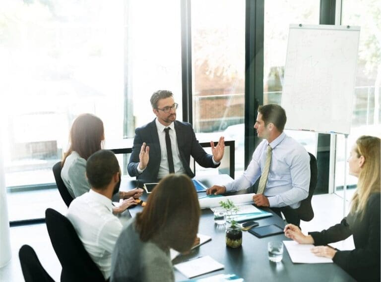 Executives discussing post-merger integration success in the first 100 days