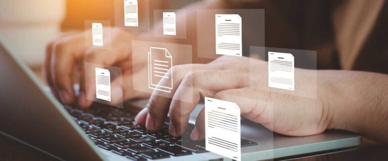 Man on his laptop with multiple document icons floating around as he documents processes